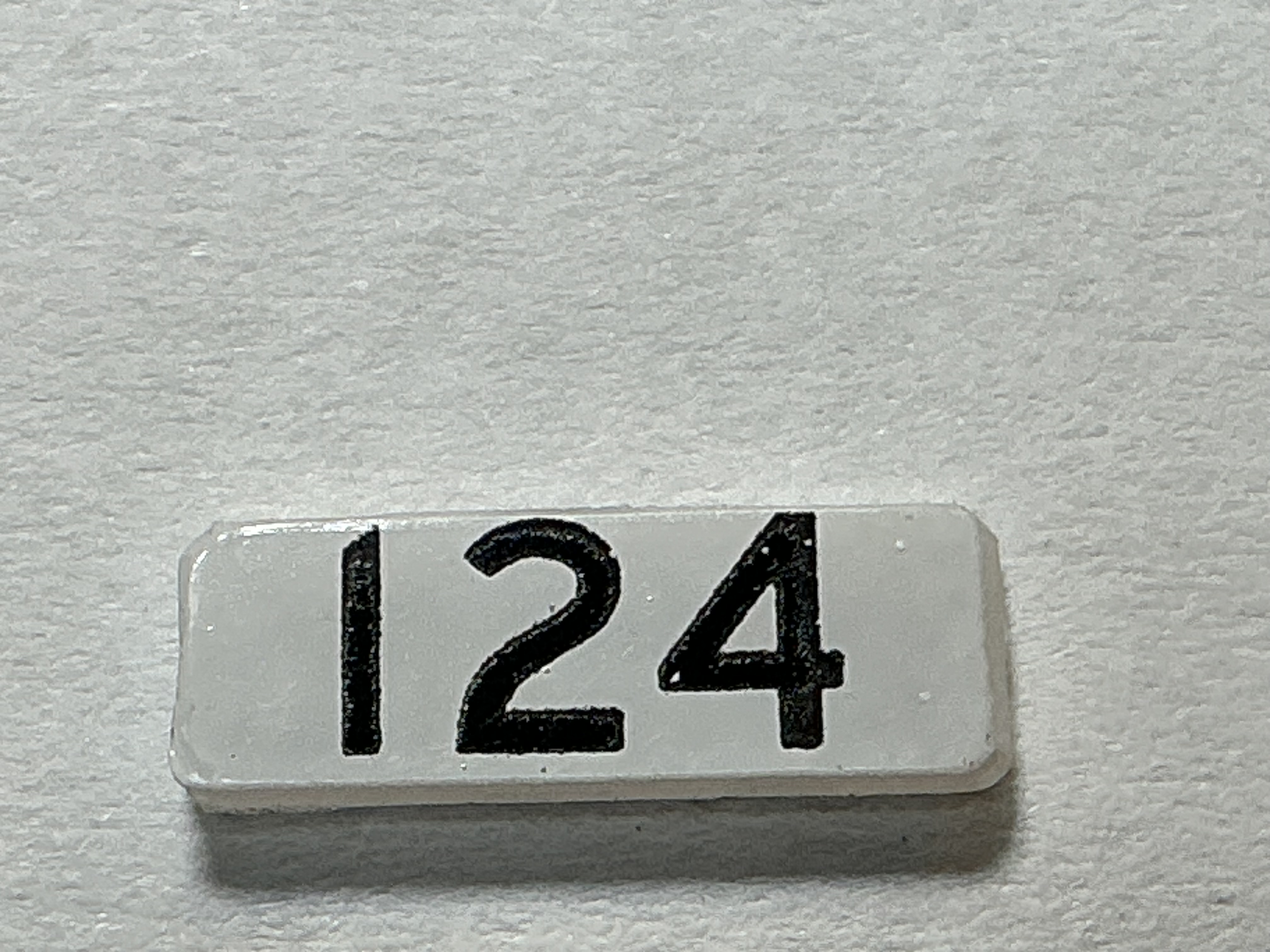 NUMBER BOARD / RH OR LH / FRONT OR REAR / #124 / PREMIER GP-40