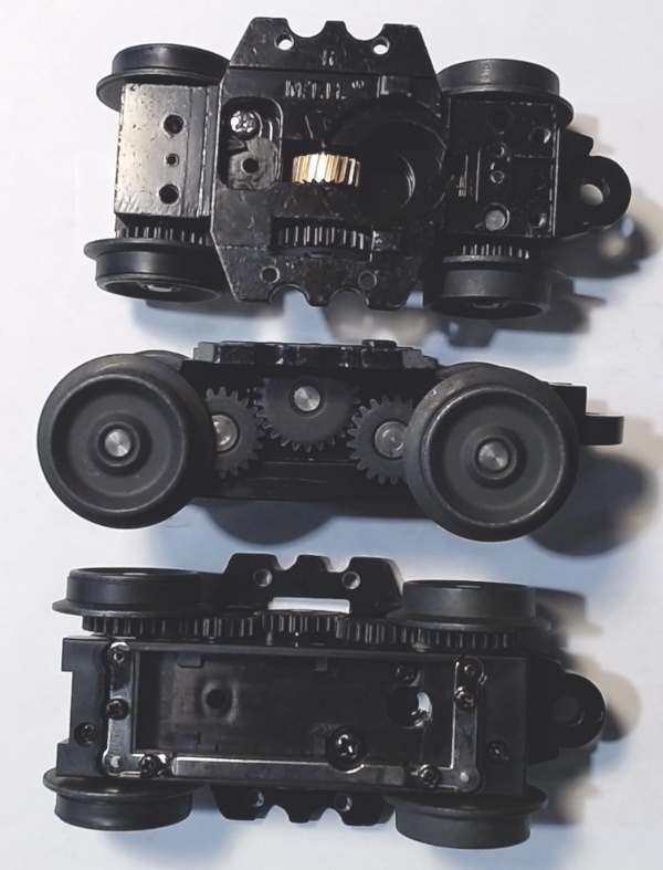 	 4-WHEEL TRUCK / POWERED / 3/2 FEATURE / REAR / BOTTOM MOUNT FRAMES / 2 HOLE PILOT MOUNT / 3-RAIL WHEELS / 57.4mm WHEEL BASE / USE BI-2100001 MOTOR MOUNT / USE MOTORS W/MD001-M8 WORM 