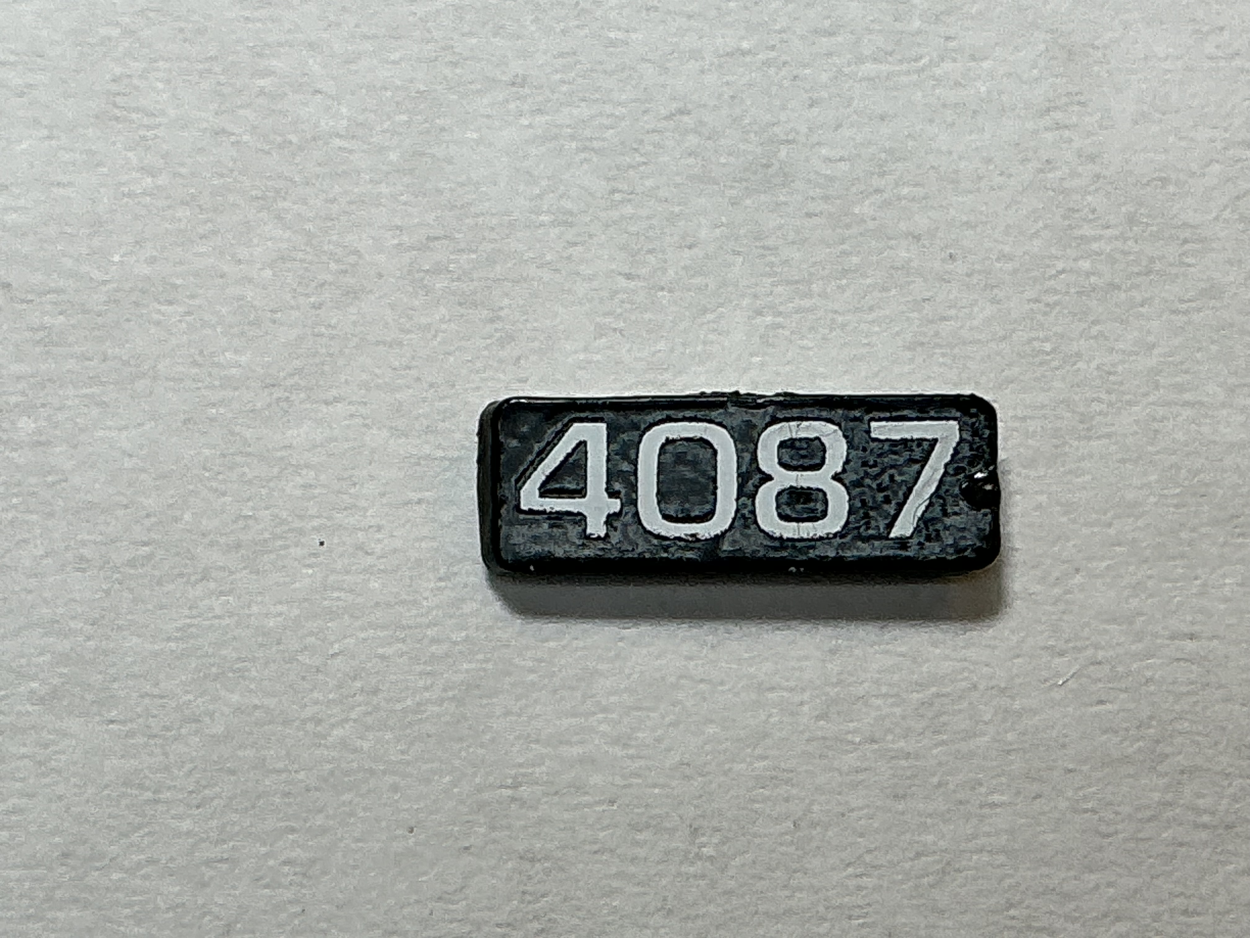 NUMBER BOARD / RH OR LH / FRONT OR REAR / #4087 / PREMIER GP-40
