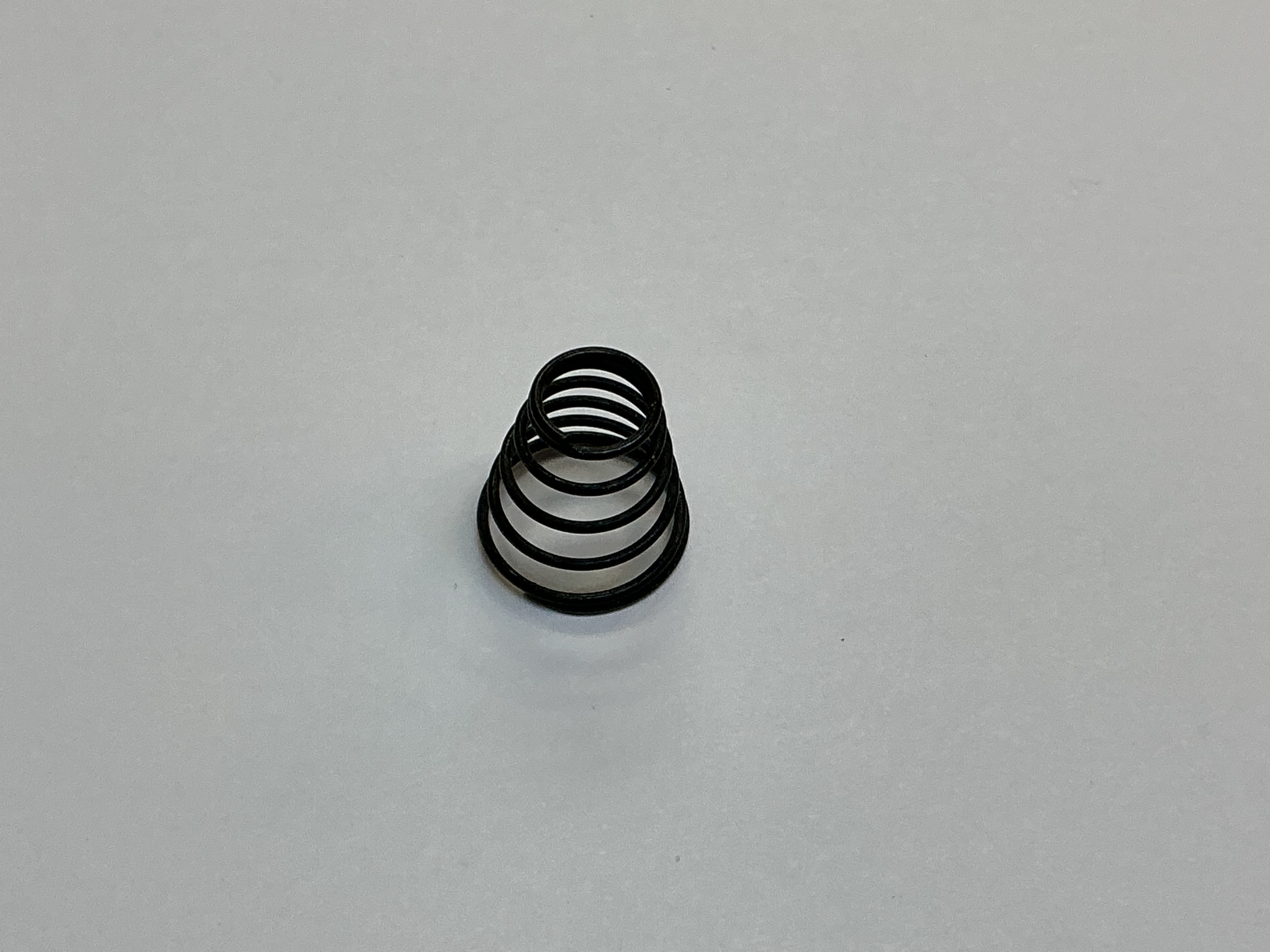 SPRING / CONICAL / 7.5mm D (TOP) x 13mm D (BOTTOM) x 13.6mm LONG / 0.7mm THICK WIRE / BLACK