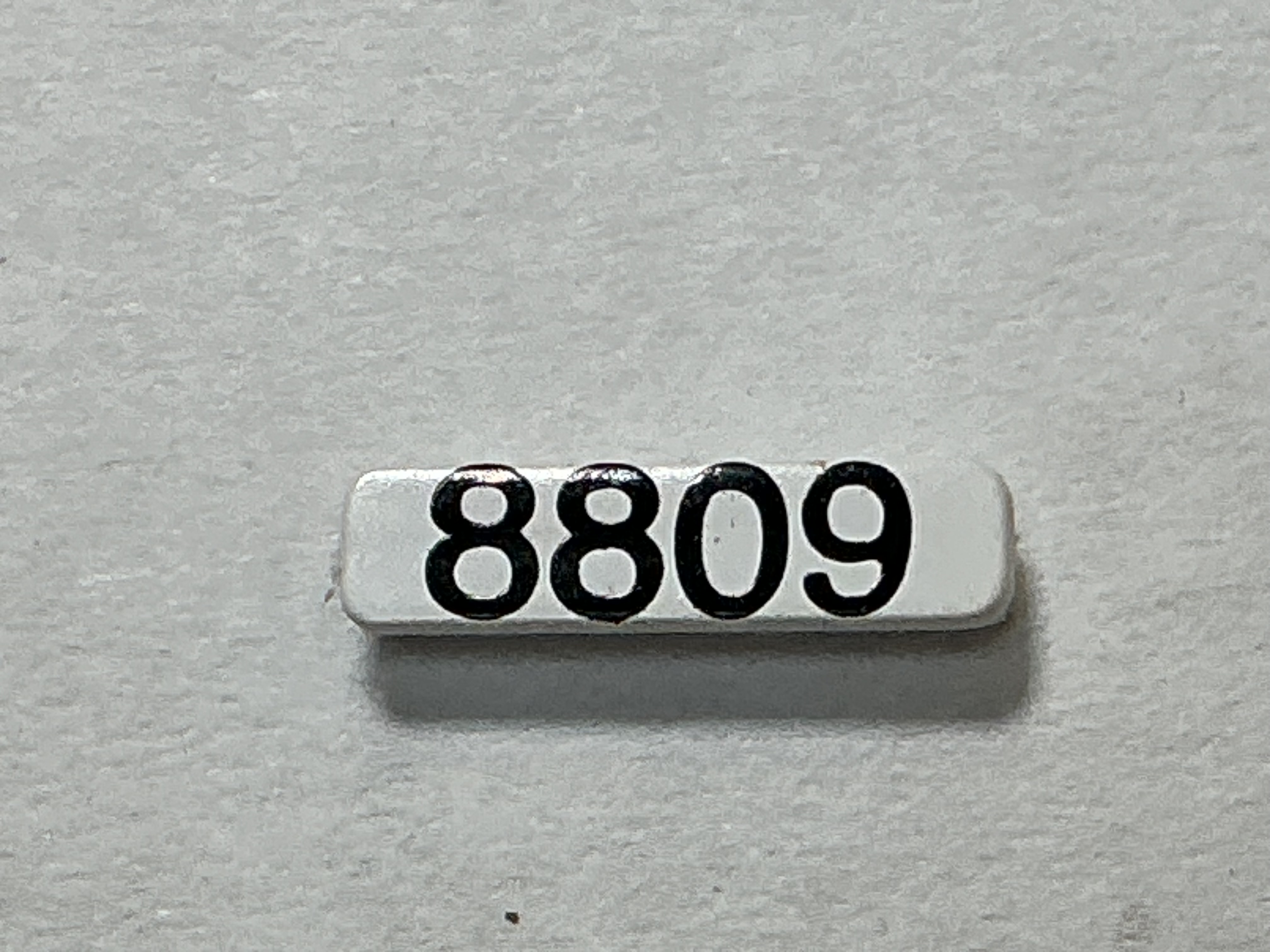 NUMBER BOARD / RH OR LH / FRONT OR REAR / #8809 / PREMIER GP-40