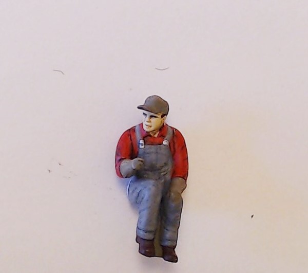 FIGURE / FIREMAN / O GAUGE / SEATED / RED SHIRT & GRAY OVERALLS / BALL CAP / STEAM & DIESEL / ALT # FI1000000