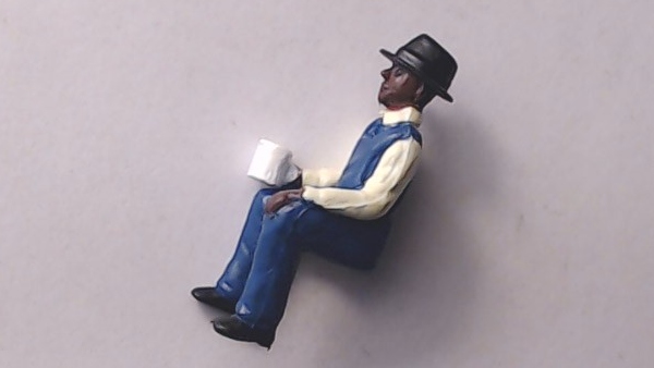 FIGURE / BRAKEMAN / SEATED / HOLDING COFFE CUP / PREMIER CABOOSE 
