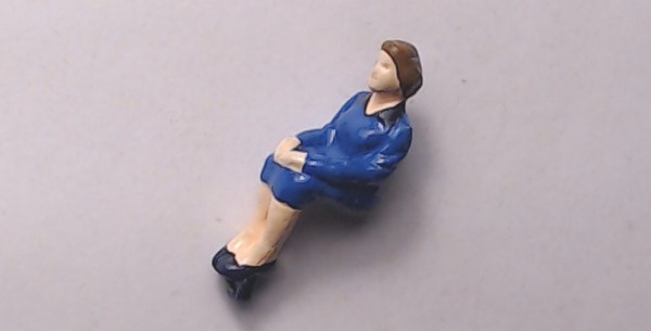 FIGURE / SITTING WOMAN / BLUE DRESS & BROWN HAIR / RAILKING OPERATING STATION PLATFORM