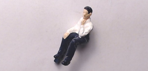 FIGURE / SITTING MAN / BLACK PANTS / WHITE SHIRT W/TIE / RAILKING OPERATING PASSENGER STATION