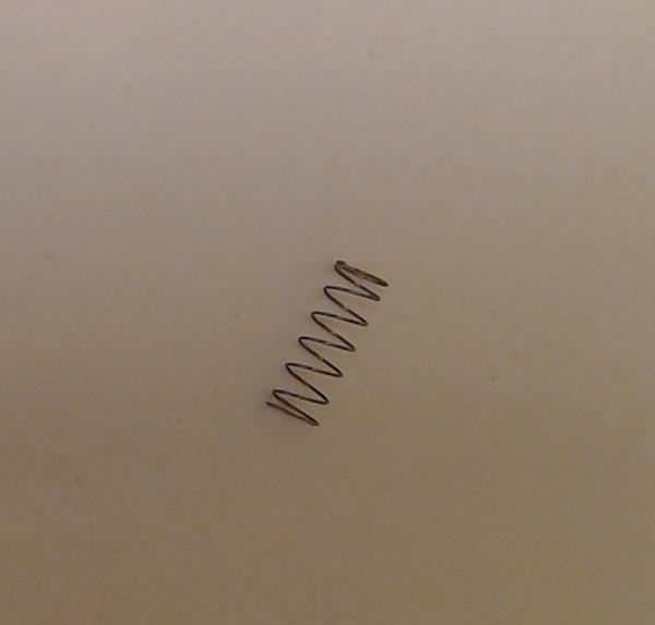 SPRING / COIL / 5mm D x 16mm L x 0.2mm THICK / RAILKING BUMP-N-GO TROLLEY